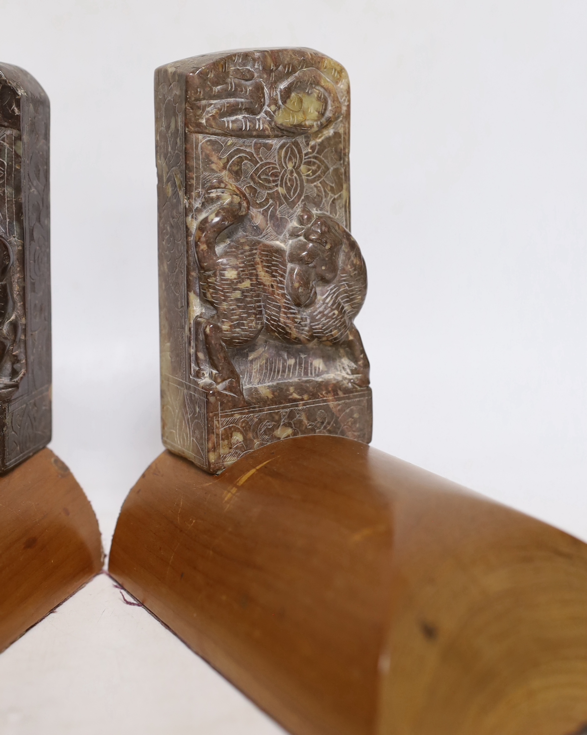 A pair of Chinese soapstone bookends, each 15cm wide